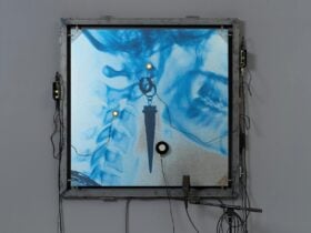 Picture of x-ray machine coloured bule with sharp object through the middle