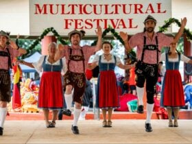 Men and women perform a traditional swiss/german dance at the Mareeba Multicultural Festival.