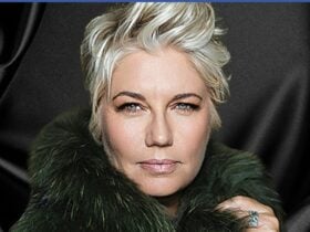 Melinda with short blonde hair swept up