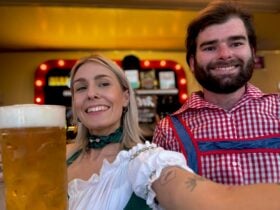Photo of a couple smiling with a beer in a stein