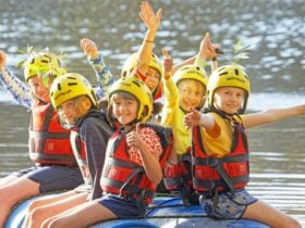 Children floating on their self-made raft