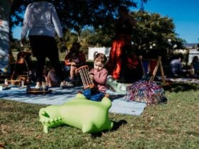 Toy bounce dragon with girl playing in background