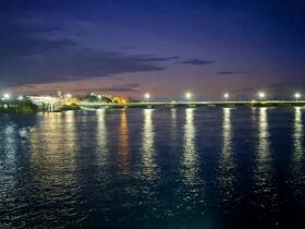 Image of Pioneer River reflecting beautiful lights at dusk