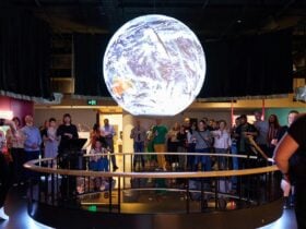 Room shot inside of SparkLab showing the Science on the Sphere installation