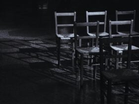Poster features six empty chairs