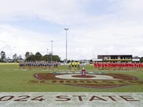 2024 Senior Female finalists line up in the pre-game ceremony in the StreetSmarts AFLQ Schools Cup