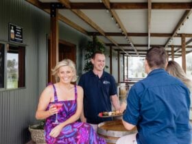 Guests enjoy cocktail on verandah