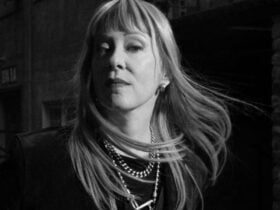 black and white image with Suzanne with long flowing hair with fringe