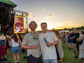 Two young men in front of a sunset