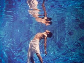 Person in pool showing reflection