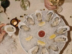 Image of oyster platter and a glass of white wine.