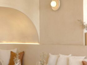 Set table inside CASA restaurant, featuring minimalist coastal luxe interiors with natural textures,