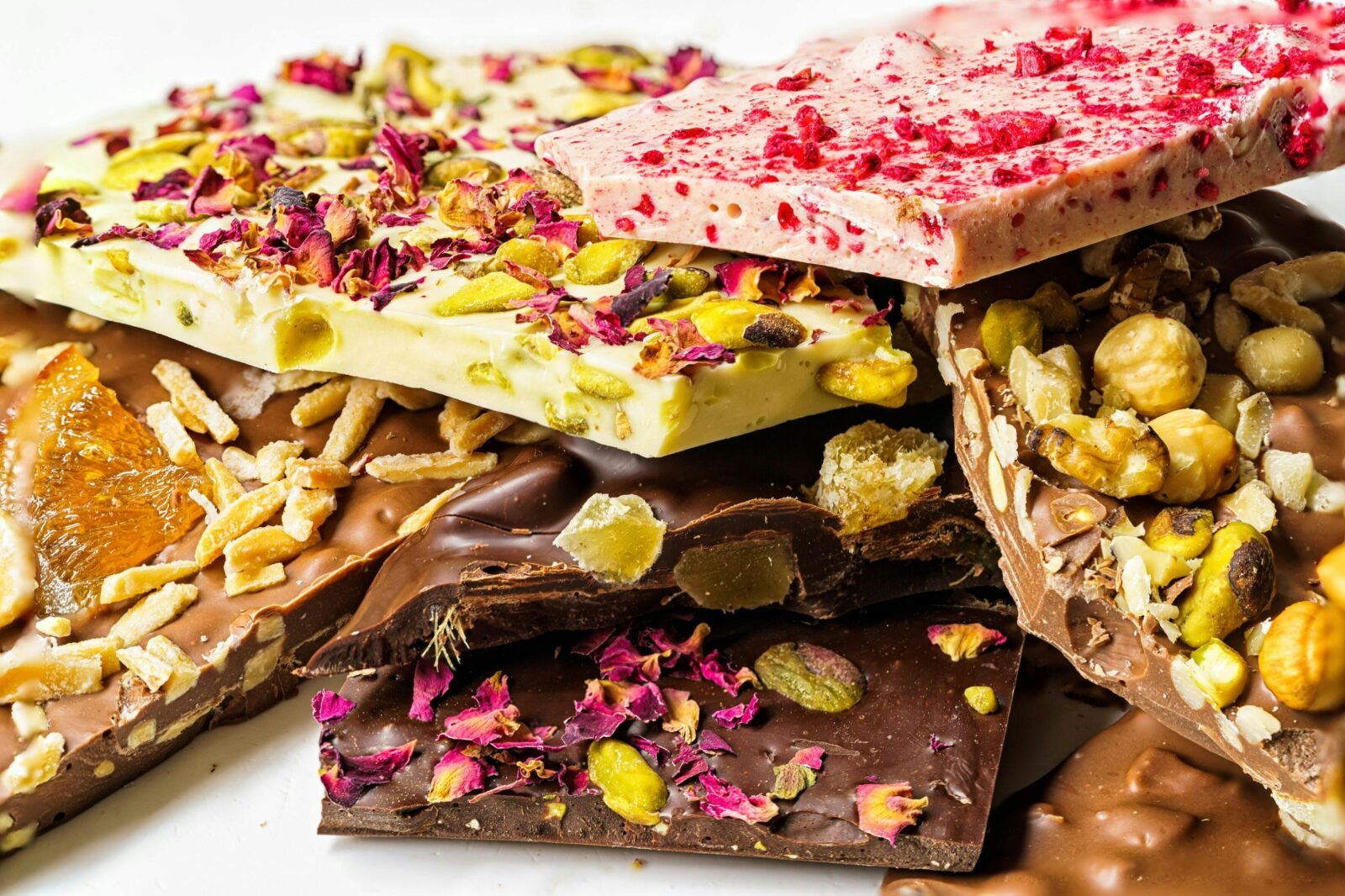 selection of colourful chocolate bars piled on top of each other