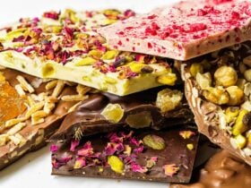selection of colourful chocolate bars piled on top of each other
