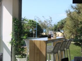 Beautiful high table on the deck facing the ocean