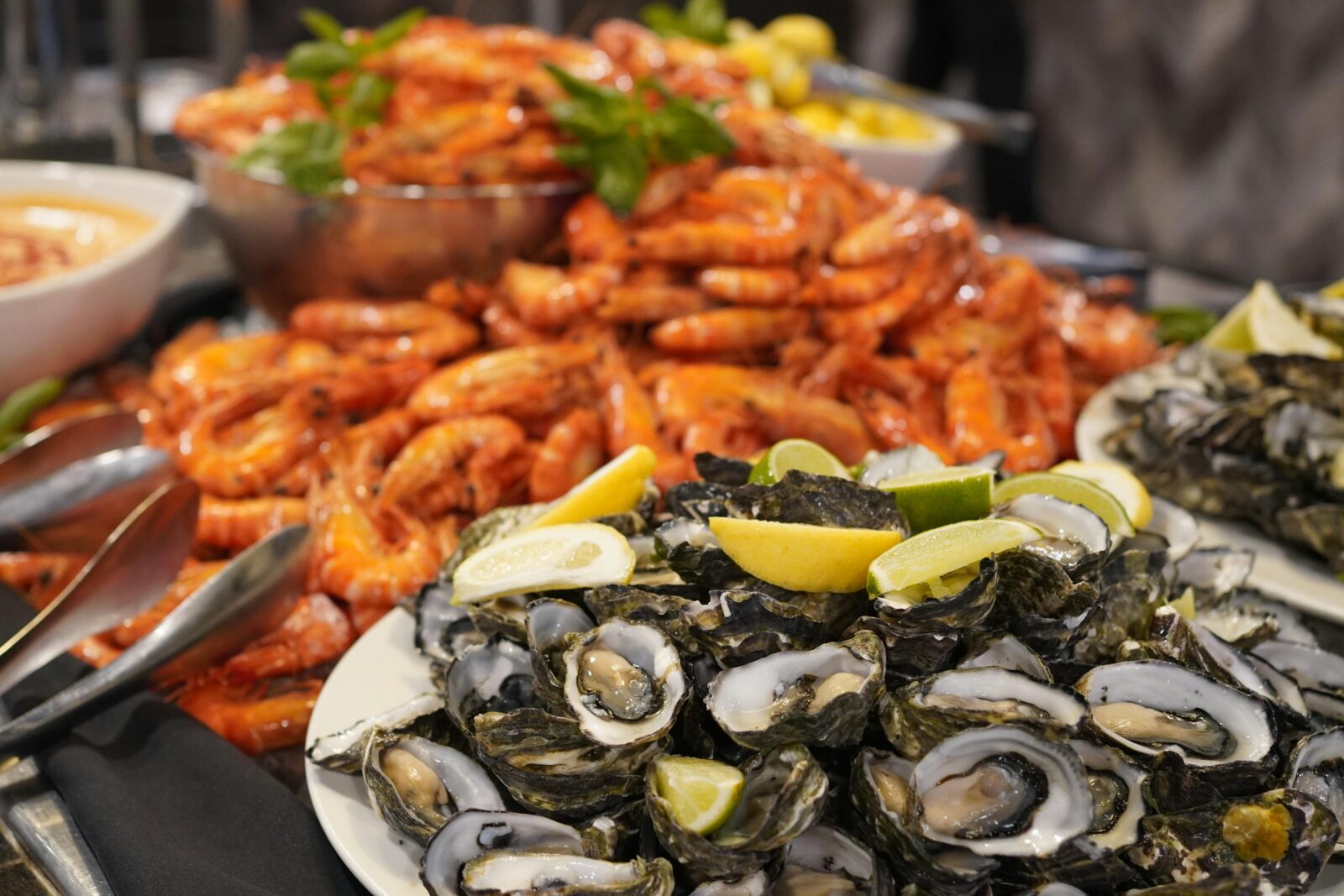An image showing fresh oysters & prawns at the buffet