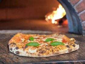 Cozy Italian restaurant with wood-fired pizzas and warm, inviting atmosphere.