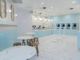 Interior of LUMA Gelato with self-serve gelato machines, seating and blue boutique design