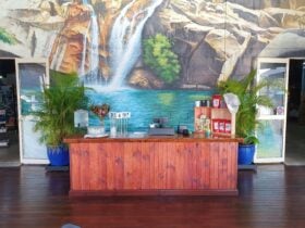 Orders in front of the mural