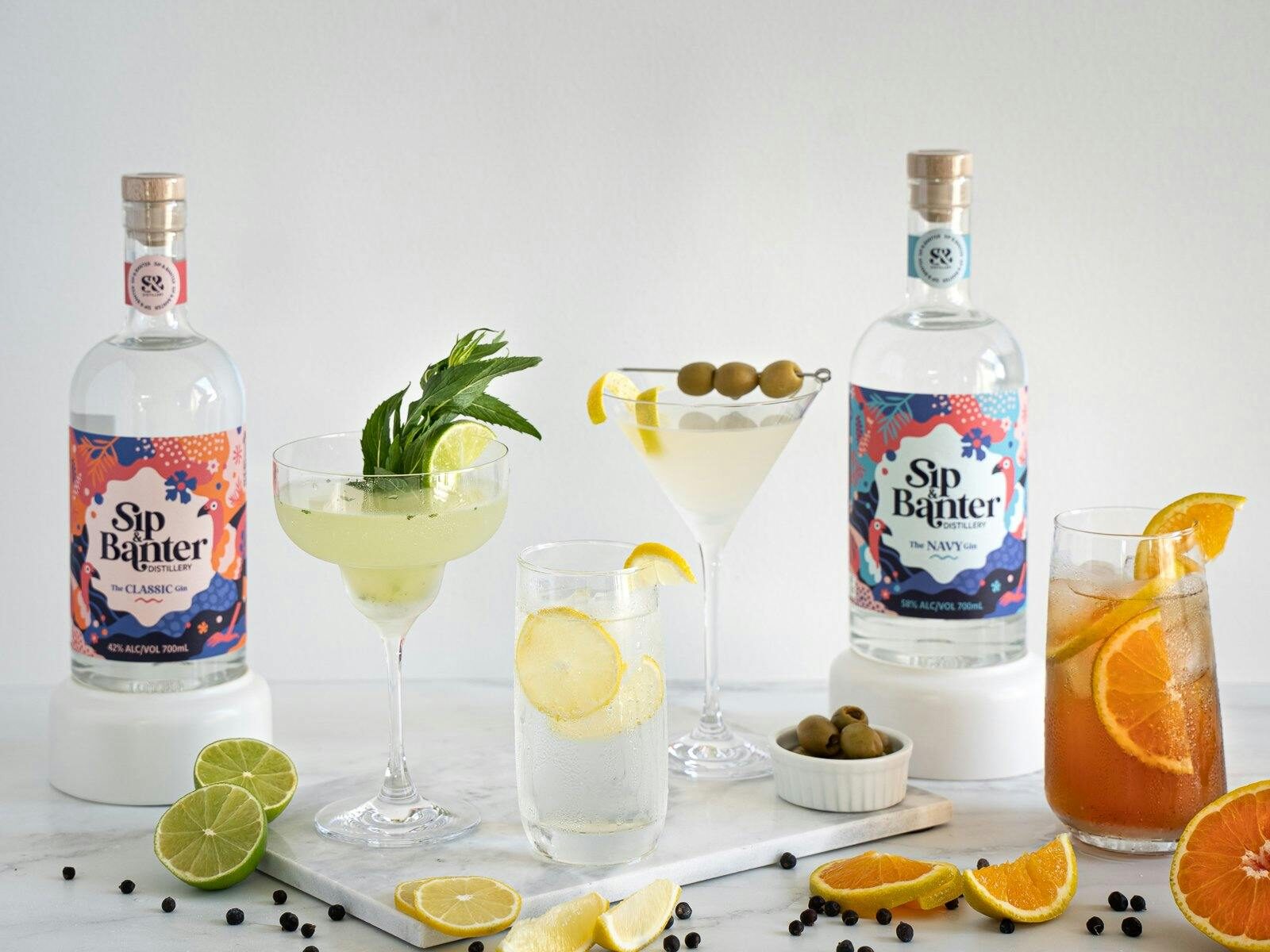 Various gin-based drinks and bottles of Gin