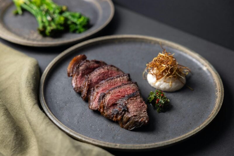 Wagyu rump cap 8+, herb sauce, alliums