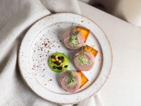 Quail Ballotine, Polenta, Herb Emulsion, Pickled Currants, Pinenuts