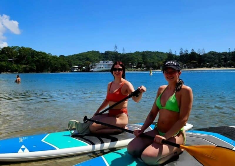 Ladies enjoying the blue sky and wonderful conditions, with All Coast Paddle Board Hire.