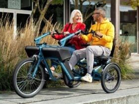 2 people riding side by side on electric trike