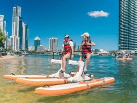 Mother and daughter riding double waterbike in Surfers Paradise