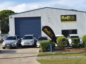 RaD Car Hire depot with rental cars parked