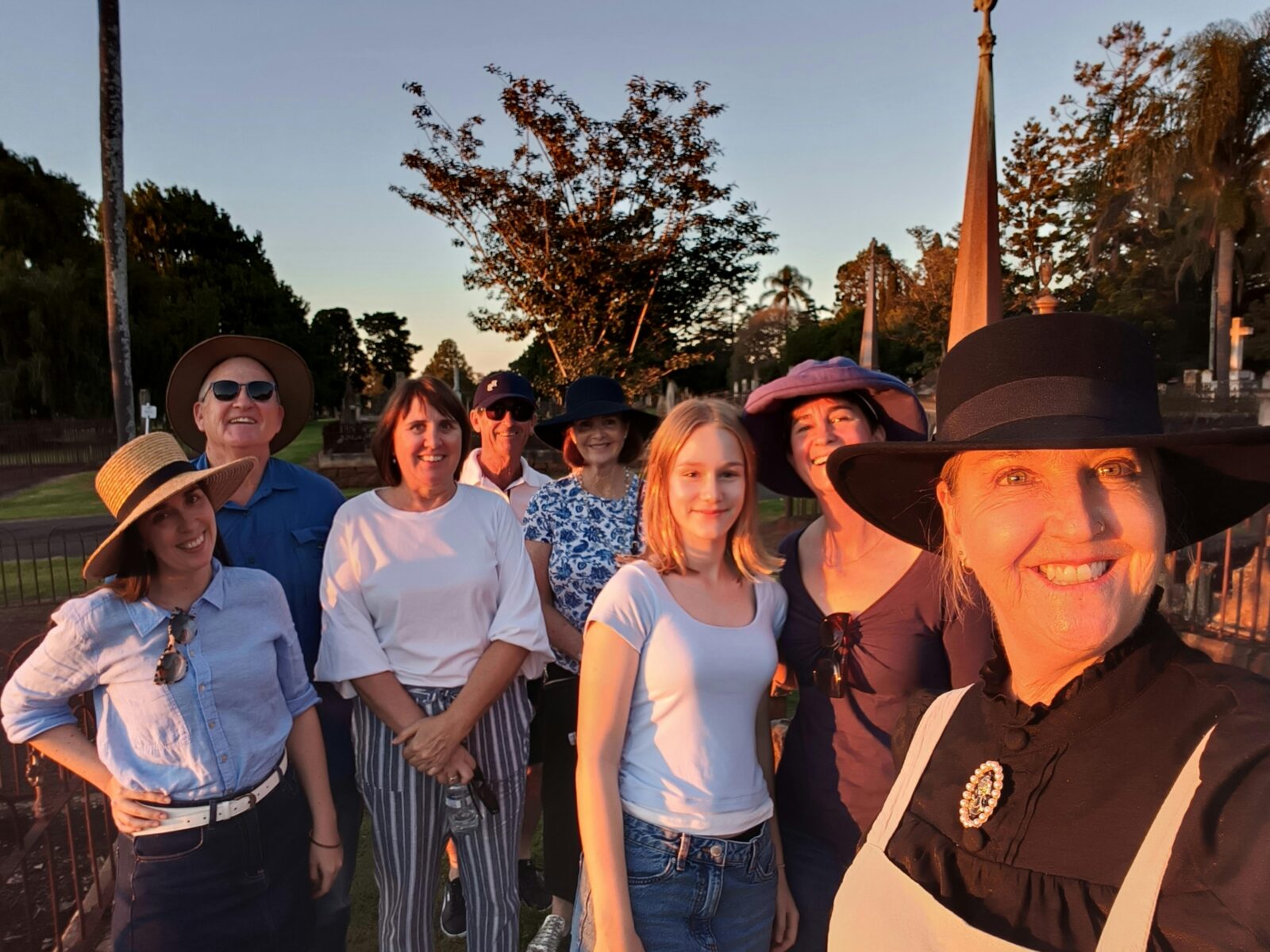 A smiling group pf people in the Drayton and Toowoomba Cemetery