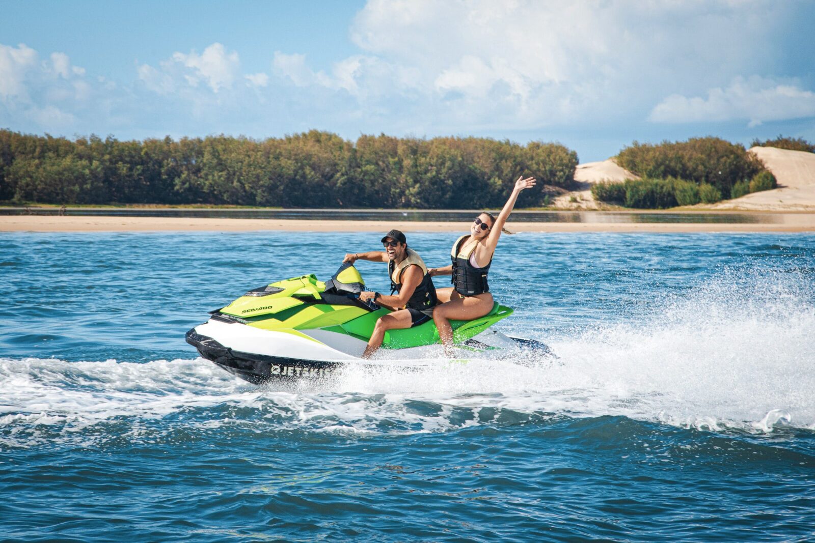 Man and woman enjoying a fun adventure on a jet ski