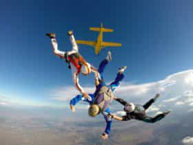 Skydive Ramblers AFF student with instructors Belgy and Tracy - Photo by Wade