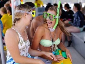 Two girls in snorkel gear laughing