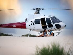 Private beach picnic with the Airbus H125 helicopter in the background