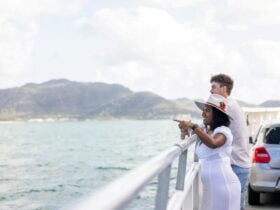 Two passengers standing on the vehicle deck of Magnetic Island Ferries looking toward Magnetic