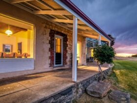 Northern side verandah, stone and glass of historic Nat's Retreat Kangaroo Island