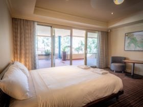large windows and doors overlooking the Murray River