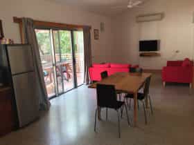 sliding door entrance from pergola/ BBQ are