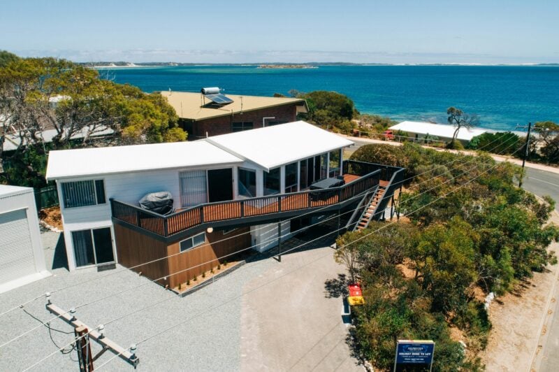 An aerial view of the house with the spectacular sea view behind
