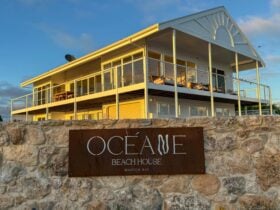 OcÃ©ane Beach House is a two story home with light filled panoramic views of the jetty and bay.