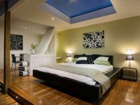 View of Ibis villa with bed underneath stargazing ceiling