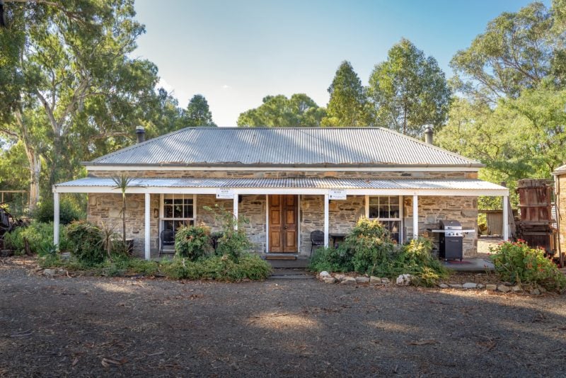 Heritage slate building that has been renovated into two cottages with a shared entrance