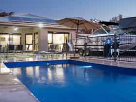 Rear yard of Villa 48B with alfresco area overlooking pool and parking space for speedboat and 2nd c