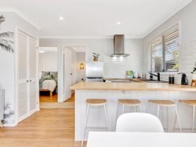 Fully equiped kitchen with bamboo bench top, brand new appliances and bench with four bar stools.