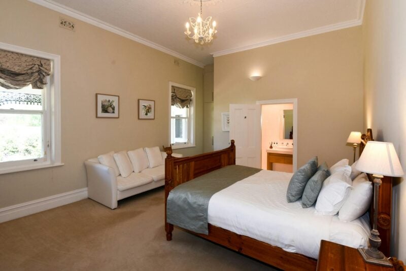 Bedroom King Size bed, sofa , windows overlooking garden chandalier pressed metal ceiling, ensuite