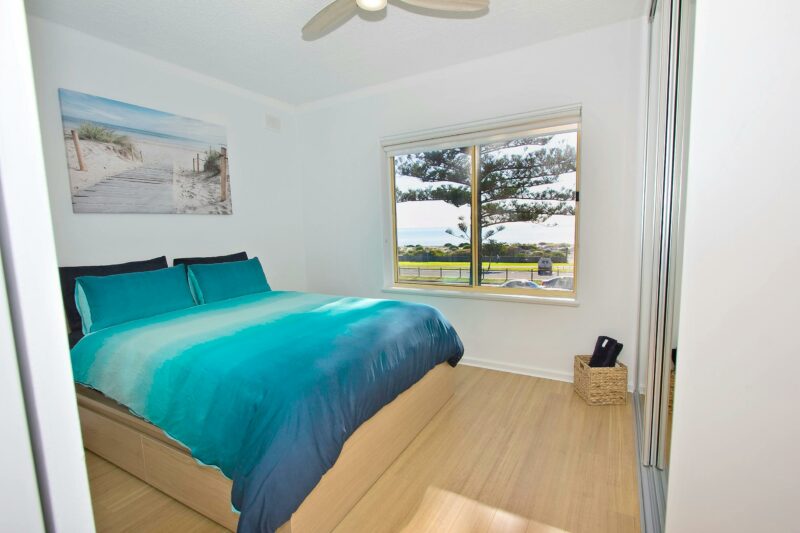 Main bedroom ocean views with a queen bed