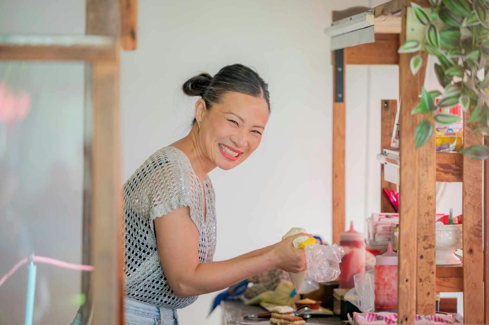 Poh Ling Yeow preparing baked goods at her Jamface stall inside the Adelaide Showground Farmersâ Mar