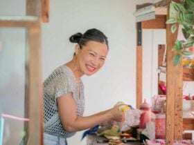 Poh Ling Yeow preparing baked goods at her Jamface stall inside the Adelaide Showground Farmersâ Mar