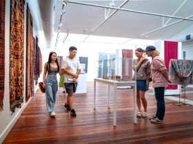 Four patrons of FABRIK walking through the Gallery looking at the exhibition